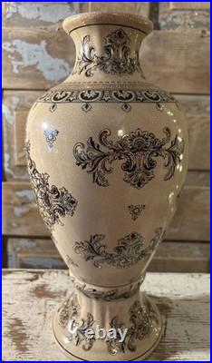 A cream-glazed Chinese porcelain vase black gold scrolling floral motifs'PCA'