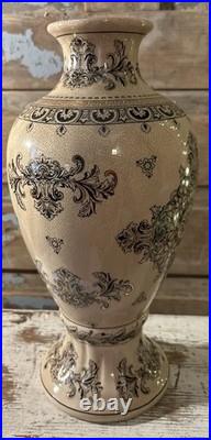 A cream-glazed Chinese porcelain vase black gold scrolling floral motifs'PCA'