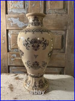 A cream-glazed Chinese porcelain vase black gold scrolling floral motifs'PCA'