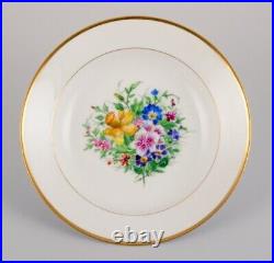 Bing & Grøndahl, four deep plates in porcelain with flowers and gold decoration