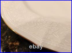 Noritake china, Chandon service for 12, in ivory, gold trim, white floral