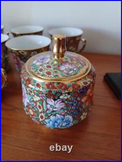 Vintage Porcelain tea cups and lidded sugar hand painted flowers gold china
