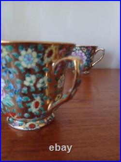 Vintage Porcelain tea cups and lidded sugar hand painted flowers gold china