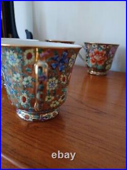 Vintage Porcelain tea cups and lidded sugar hand painted flowers gold china