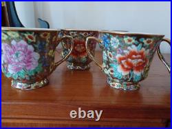 Vintage Porcelain tea cups and lidded sugar hand painted flowers gold china