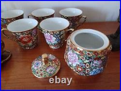Vintage Porcelain tea cups and lidded sugar hand painted flowers gold china