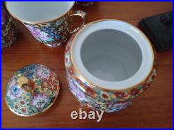 Vintage Porcelain tea cups and lidded sugar hand painted flowers gold china